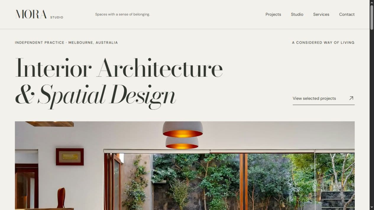 MORA Studio’s homepage, combining a large serif headline, generous spacing, and a timber interior opening onto a garden.